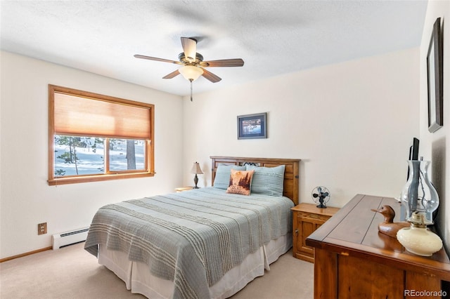bedroom with baseboards, a baseboard radiator, a ceiling fan, a textured ceiling, and light colored carpet
