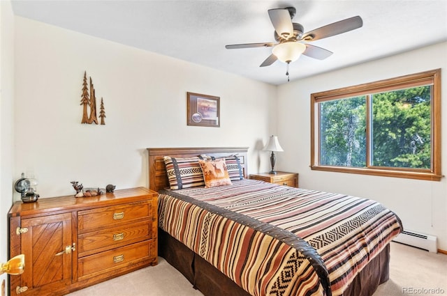 bedroom featuring baseboard heating, light colored carpet, and ceiling fan