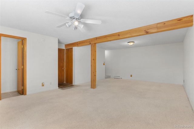 interior space with a baseboard radiator and ceiling fan