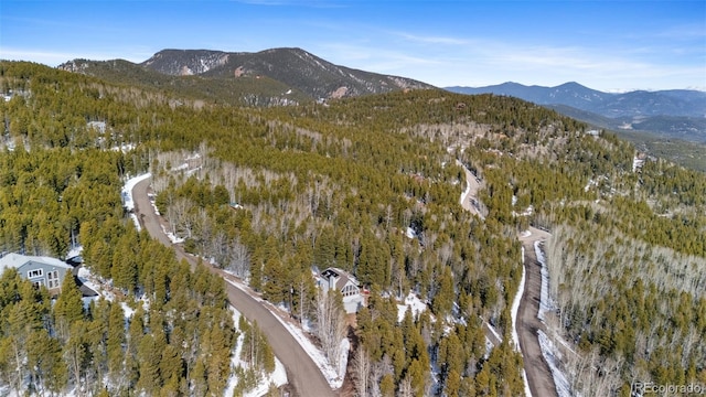 bird's eye view featuring a mountain view and a forest view