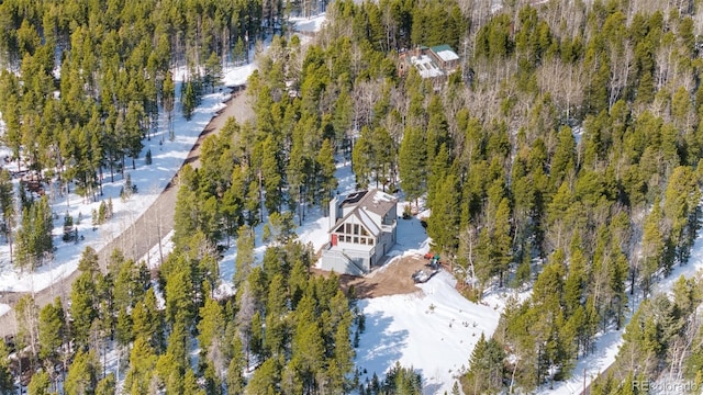 birds eye view of property with a wooded view