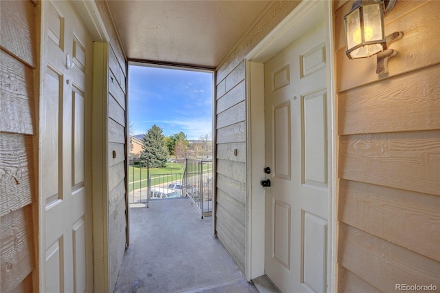 doorway to outside featuring a wall of windows