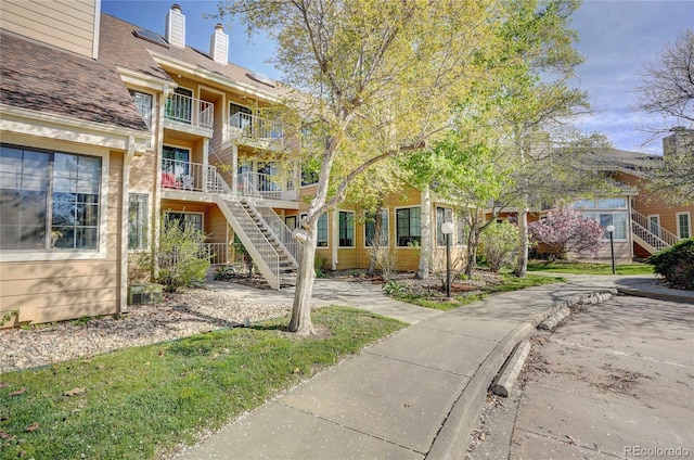 view of home's community featuring stairs