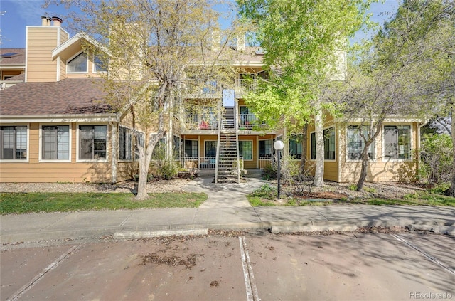 view of front of home featuring stairway