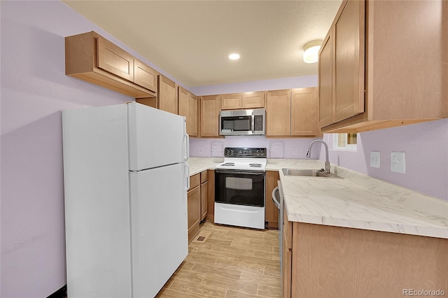 922 S Dearborn Way Unit 8, Aurora, CO 80012 - kitchen featuring stainless steel microwave, electric range, a sink, freestanding refrigerator, and light countertops