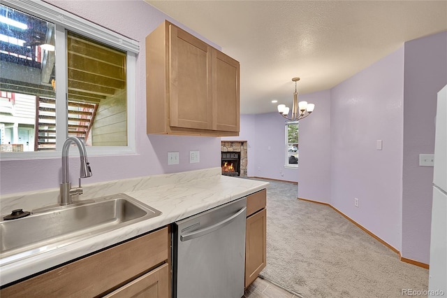922 S Dearborn Way Unit 8, Aurora, CO 80012 - kitchen with dishwasher, a sink, light countertops, a chandelier, and light carpet