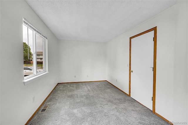 922 S Dearborn Way Unit 8, Aurora, CO 80012 - unfurnished room featuring carpet, a textured ceiling, and baseboards