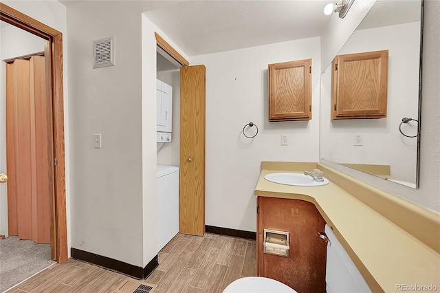 922 S Dearborn Way Unit 8, Aurora, CO 80012 - bathroom featuring toilet, wood finished floors, vanity, and baseboards