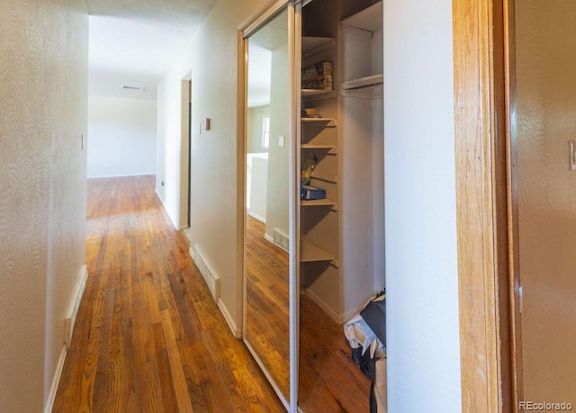 hallway featuring hardwood / wood-style flooring