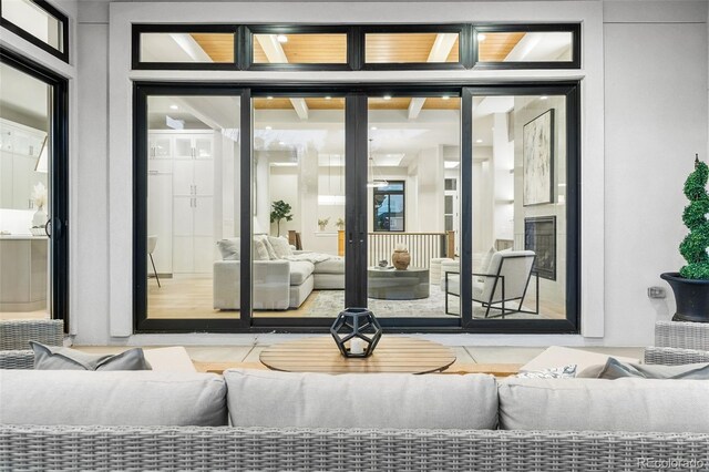 doorway to property featuring an outdoor hangout area