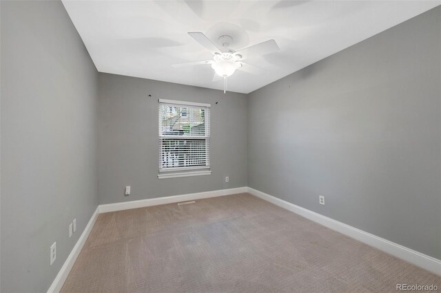 11245 San Joaquin Rdg, Littleton, CO 80127 - empty room with a ceiling fan, baseboards, and light carpet