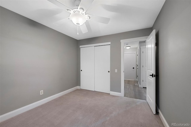 11245 San Joaquin Rdg, Littleton, CO 80127 - unfurnished bedroom with carpet flooring, a closet, baseboards, and ceiling fan