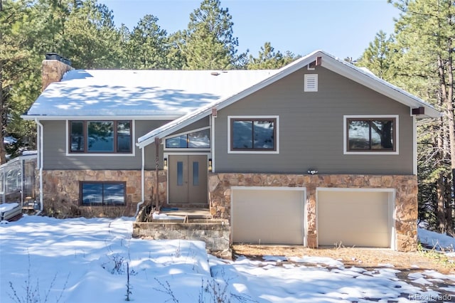 raised ranch featuring a garage