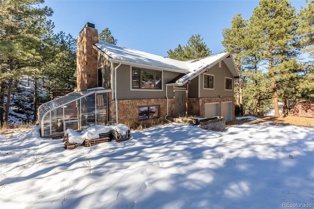 view of front of house featuring an outbuilding and a garage