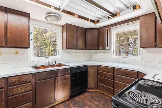 kitchen with dishwasher, sink, dark wood-type flooring, range with electric stovetop, and dark brown cabinets