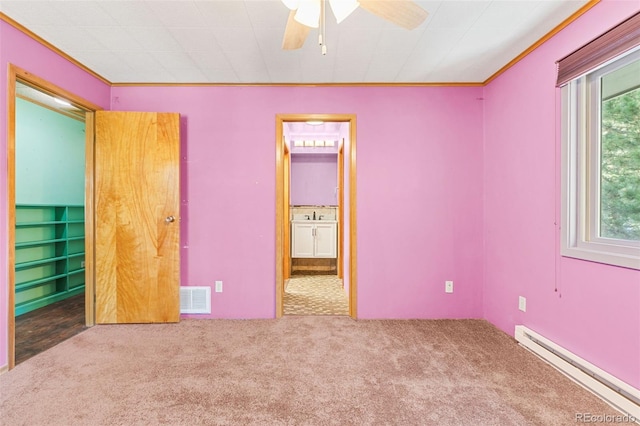 unfurnished bedroom with carpet flooring, a baseboard radiator, ceiling fan, and ornamental molding