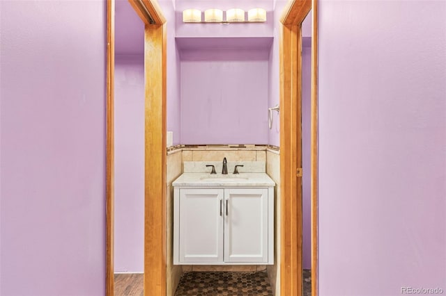 bathroom with vanity and hardwood / wood-style flooring