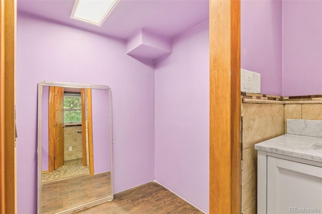 interior space featuring hardwood / wood-style flooring and vanity