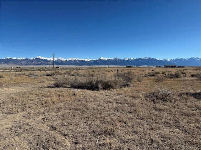 property view of mountains featuring a rural view