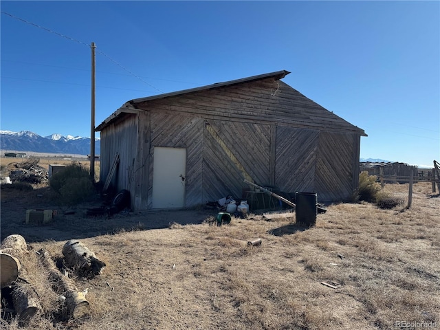 view of outbuilding with a mountain view