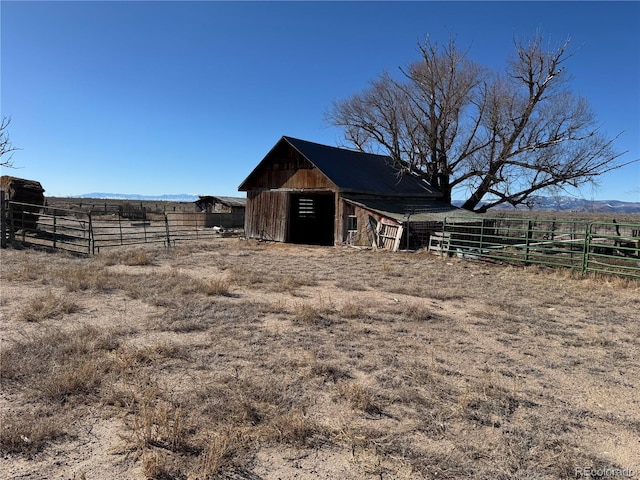 view of outbuilding featuring a rural view