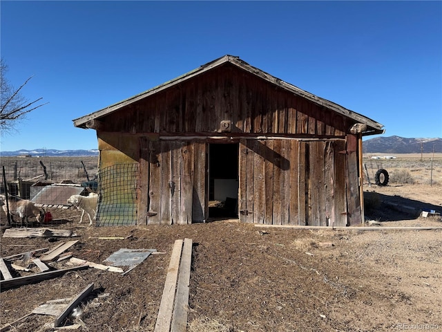 view of outbuilding featuring a mountain view