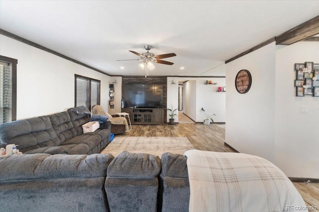 living area featuring recessed lighting, wood finished floors, a ceiling fan, and crown molding