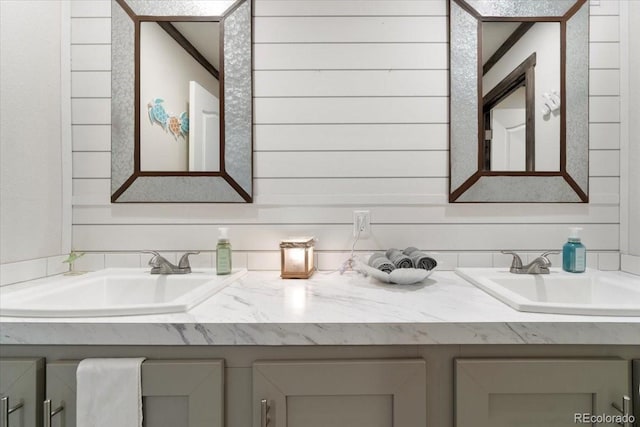 bathroom with double vanity and a sink