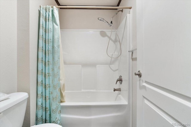 bathroom with shower / bath combination with curtain and toilet