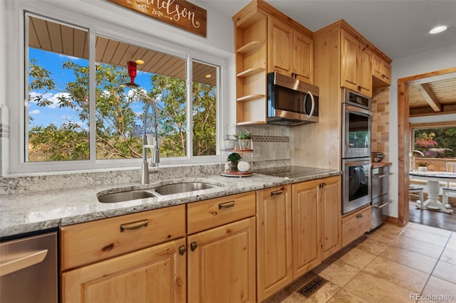 1380 Oak Valley Rd, Sedalia, CO 80135 - kitchen with stainless steel appliances, open shelves, light stone countertops, tasteful backsplash, and light tile patterned floors