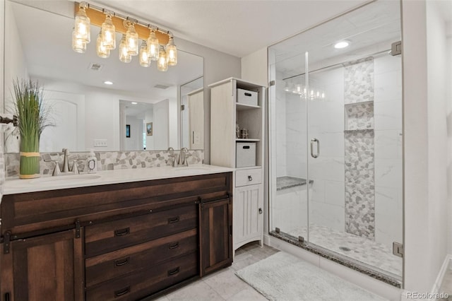 1380 Oak Valley Rd, Sedalia, CO 80135 - bathroom with double vanity, a shower stall, a chandelier, and recessed lighting