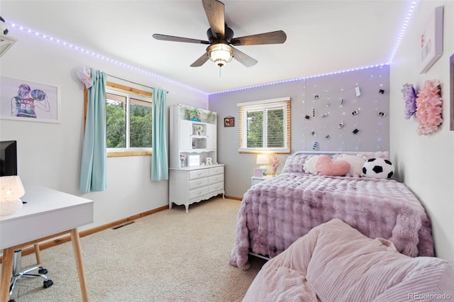 1380 Oak Valley Rd, Sedalia, CO 80135 - carpeted bedroom with multiple windows and a ceiling fan