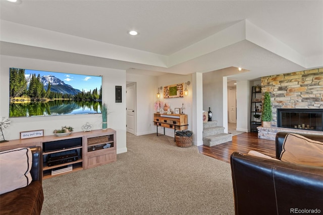 1380 Oak Valley Rd, Sedalia, CO 80135 - carpeted living room featuring a stone fireplace, recessed lighting, and stairway