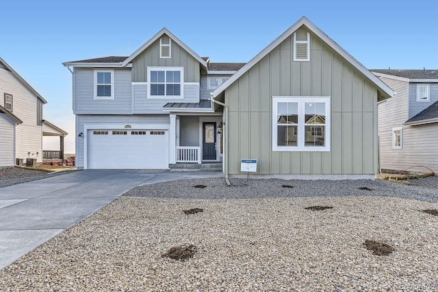 view of front of property featuring central air condition unit, a shingled roof, an attached garage, board and batten siding, and driveway