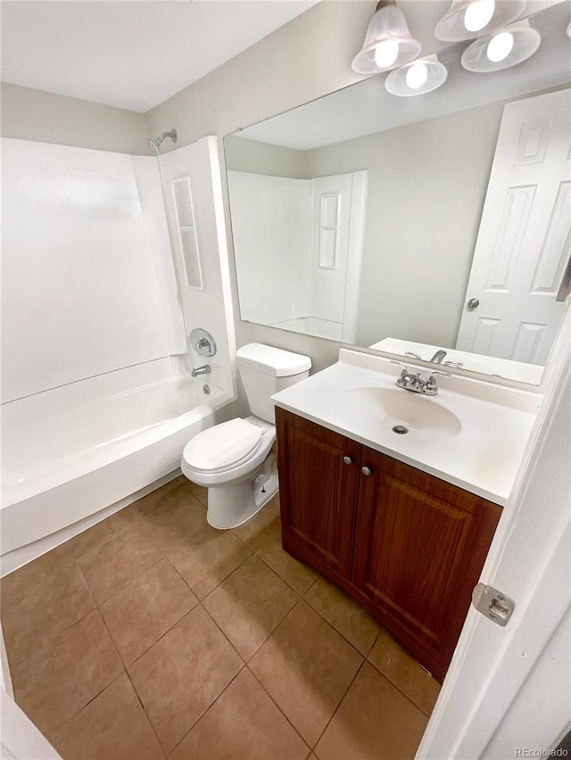 full bathroom featuring vanity, bathing tub / shower combination, tile patterned floors, and toilet