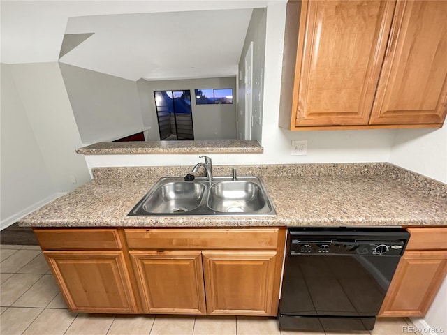 kitchen featuring black dishwasher, sink, light stone countertops, and light tile patterned floors