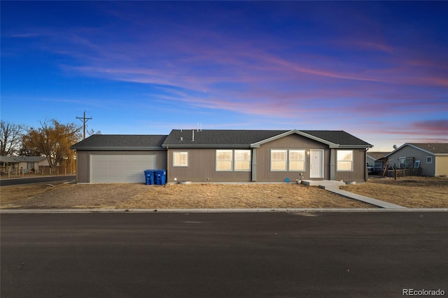 ranch-style home featuring a garage