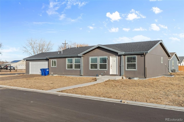 ranch-style home featuring a garage