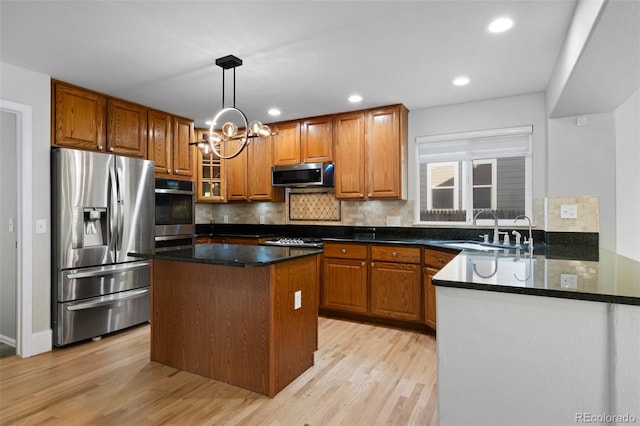 7837 Aravon Ct, Lone Tree, CO 80124 - kitchen featuring appliances with stainless steel finishes, a sink, light wood-style floors, brown cabinetry, and recessed lighting