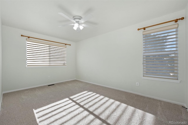 7837 Aravon Ct, Lone Tree, CO 80124 - spare room with carpet floors, plenty of natural light, ceiling fan, and baseboards
