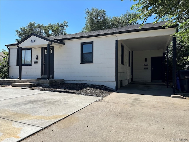 2946 W Park Pl, Denver, CO 80219 - ranch-style house with driveway and an attached carport