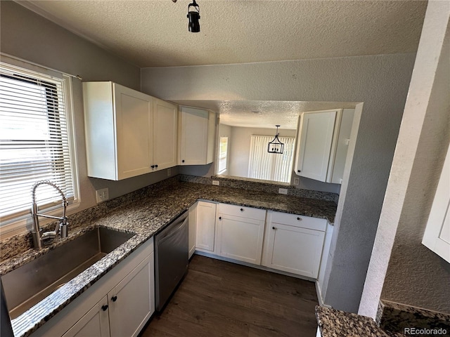 2946 W Park Pl, Denver, CO 80219 - kitchen with stainless steel dishwasher, a textured ceiling, a textured wall, dark wood-style floors, and white cabinets