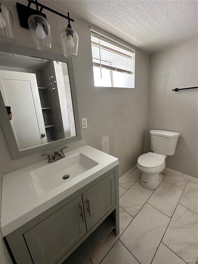 2946 W Park Pl, Denver, CO 80219 - bathroom with a textured ceiling and vanity