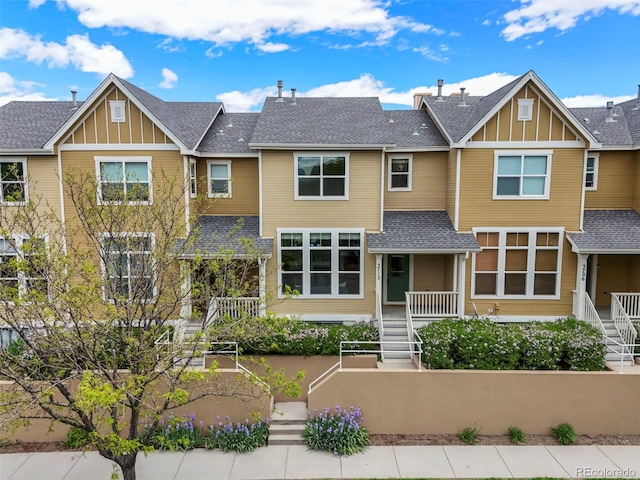 3712 Wolff St, Denver, CO 80212 - view of front of home featuring board and batten siding, stairs, and a shingled roof