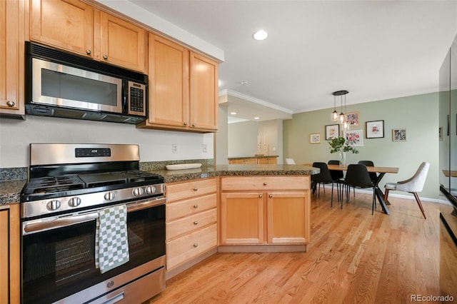 3712 Wolff St, Denver, CO 80212 - kitchen featuring appliances with stainless steel finishes, light wood-type flooring, a peninsula, light brown cabinets, and crown molding