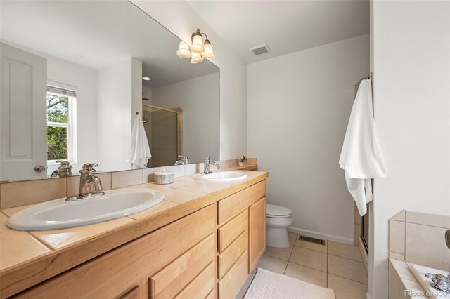 3712 Wolff St, Denver, CO 80212 - bathroom with a shower stall, double vanity, tile patterned flooring, a bathtub, and toilet