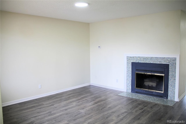 interior space with wood-type flooring and a textured ceiling