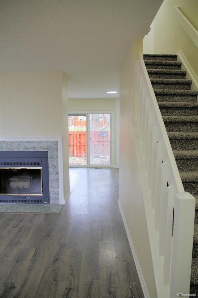 stairway featuring hardwood / wood-style flooring