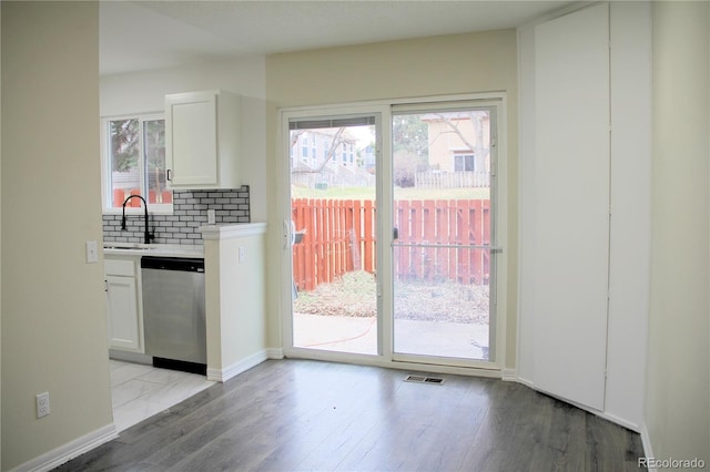 entryway with light wood-type flooring and sink