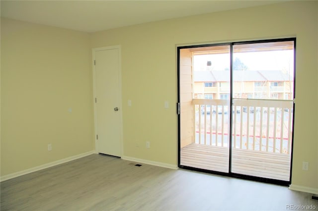 spare room featuring light wood-type flooring